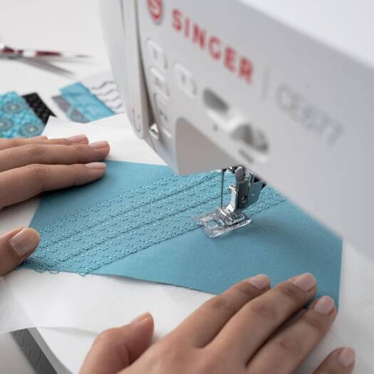 SINGER CE677 Electric Sewing Machine Heavy-Duty Metal Frame, White, Portable & User-Friendly, LCD Screen Displays Stitch Number, Settings, Presser Foot, 6.3" sewing space | CE677 - NEW AL AFRAH
